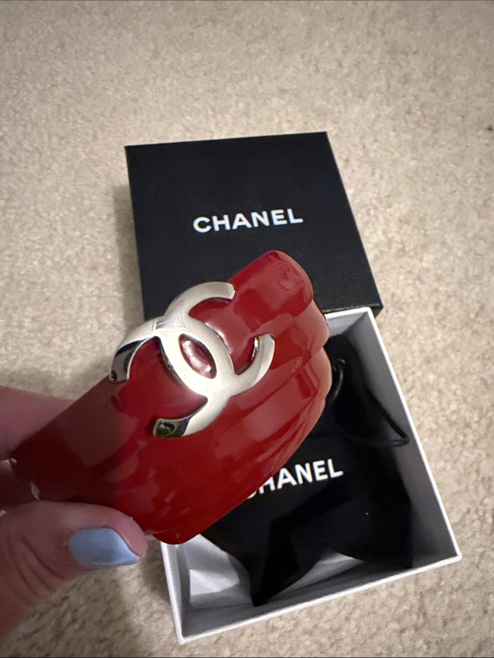 CHANEL Red Resin Cuff with Silver CC Emblem